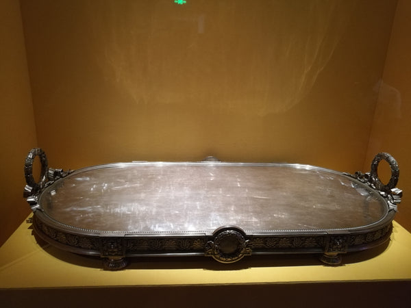 Silver platter with carved handles
