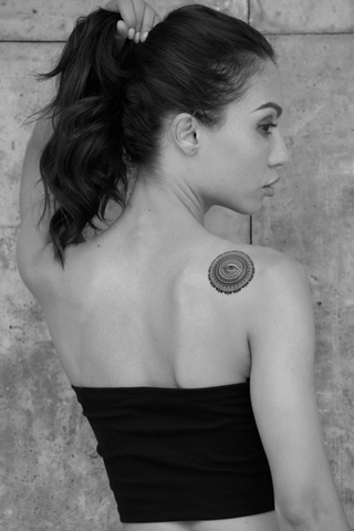 round eye back tattoo