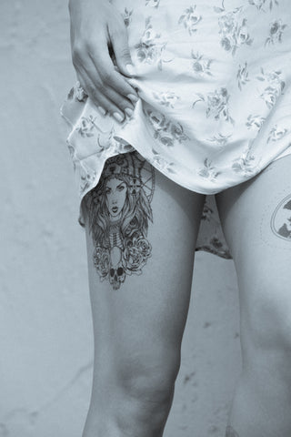 wolf head-dressed girl tattoo