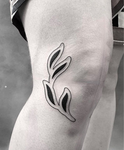 plant leaf knee tattoo