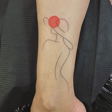 fine line woman leg tattoo