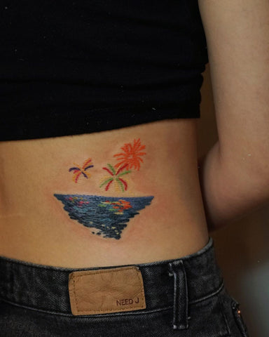 ocean sea firework tattoo on waist