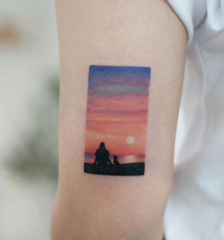 sunset tattoo on forearm