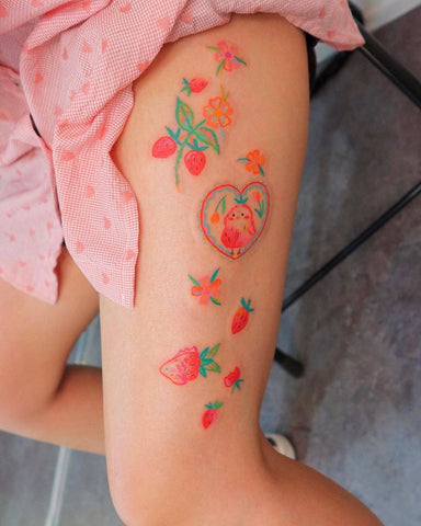 strawberry leg tattoo