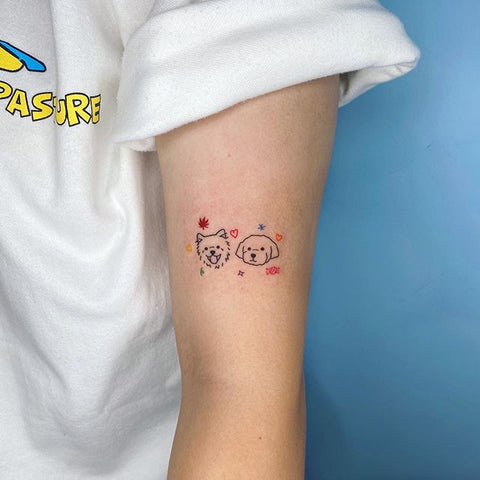 tiny dog arm tattoo