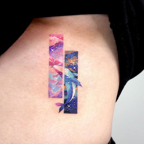 dolphin frame rib tattoo