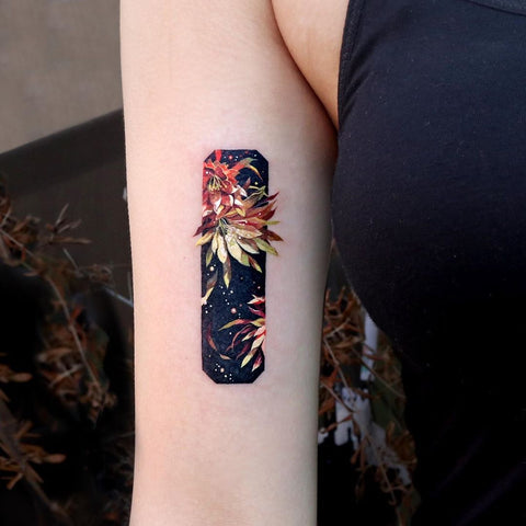 Metallic floral frame arm tattoo