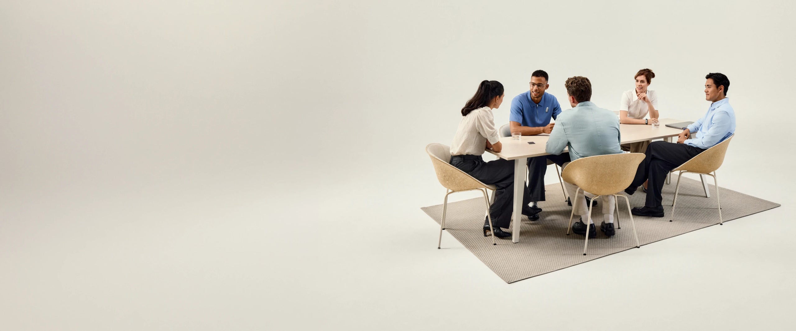 Five diverse professionals in a meeting around a table, with a Plaud AI voice recorder capturing their discussion.