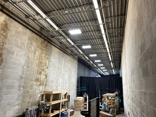 Linear LED high bay lights in a shop.
