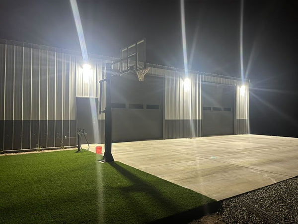 The LED wall pack light light up the outdoor patio and field.