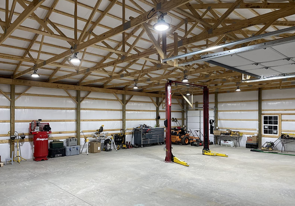 The led high bay light is bright and light up the car lift in the shop..