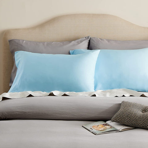 Sky blue bamboo viscose pillowcases on pillows on bed - photo by Bedsure