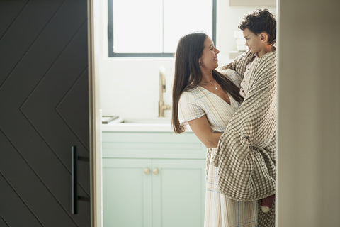 Mother's Day - Mom holding boy wrapped in Bedsure blanket