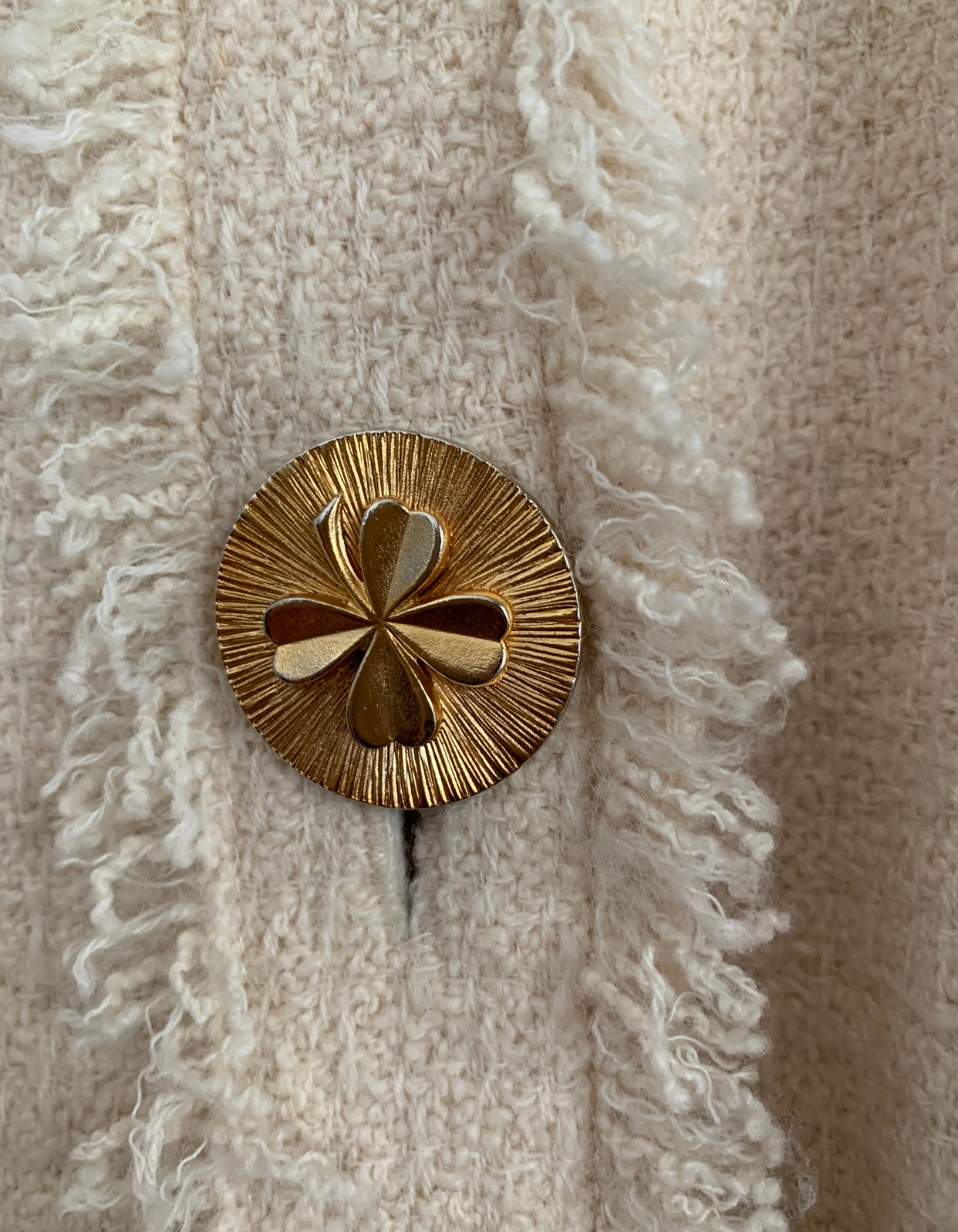 Chanel cream suit with large gold clover buttons