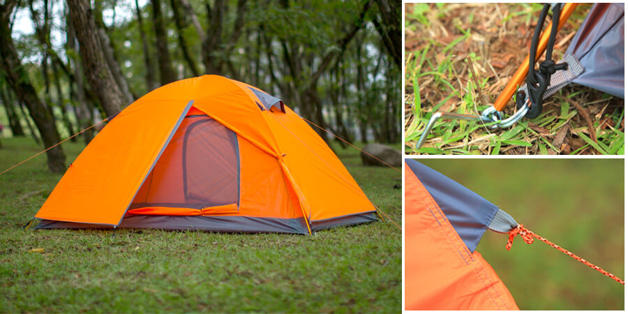 Orange camping tent in a field