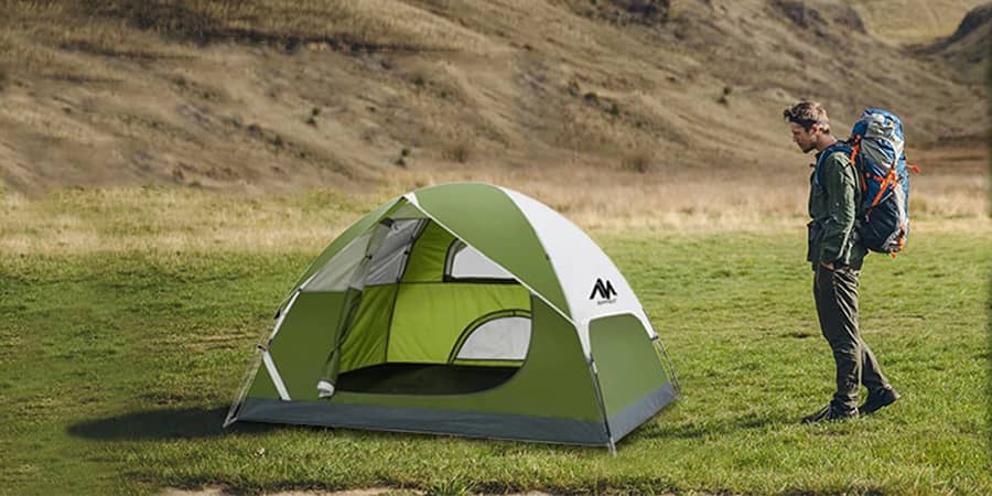 Ayamaya green camping tent in a green field 