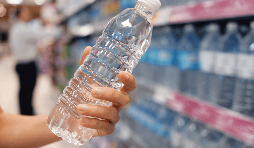 picking up bottled drinking water at the supermarket