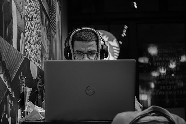 Frowning man staring at the computer