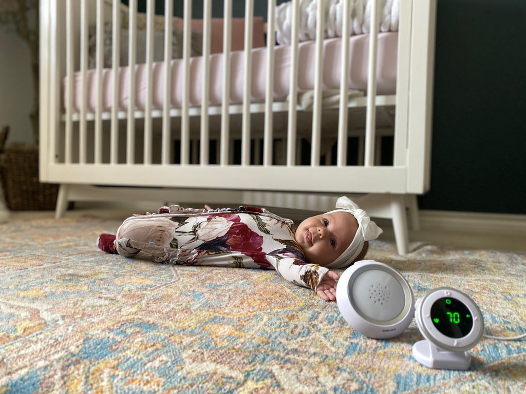 Baby with bebcare baby monitor in the nursery
