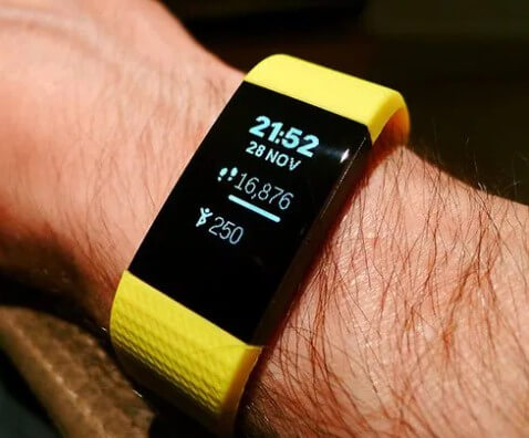 Wearing Fitbit fitness tracker