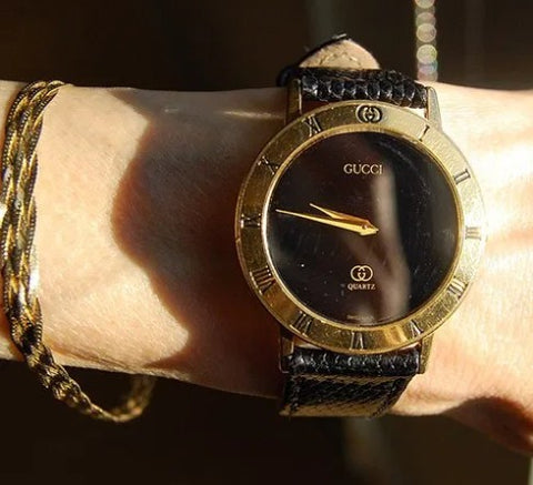 Wearing Gucci watch