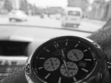 Driver showing off their Citizen Chronograph.
