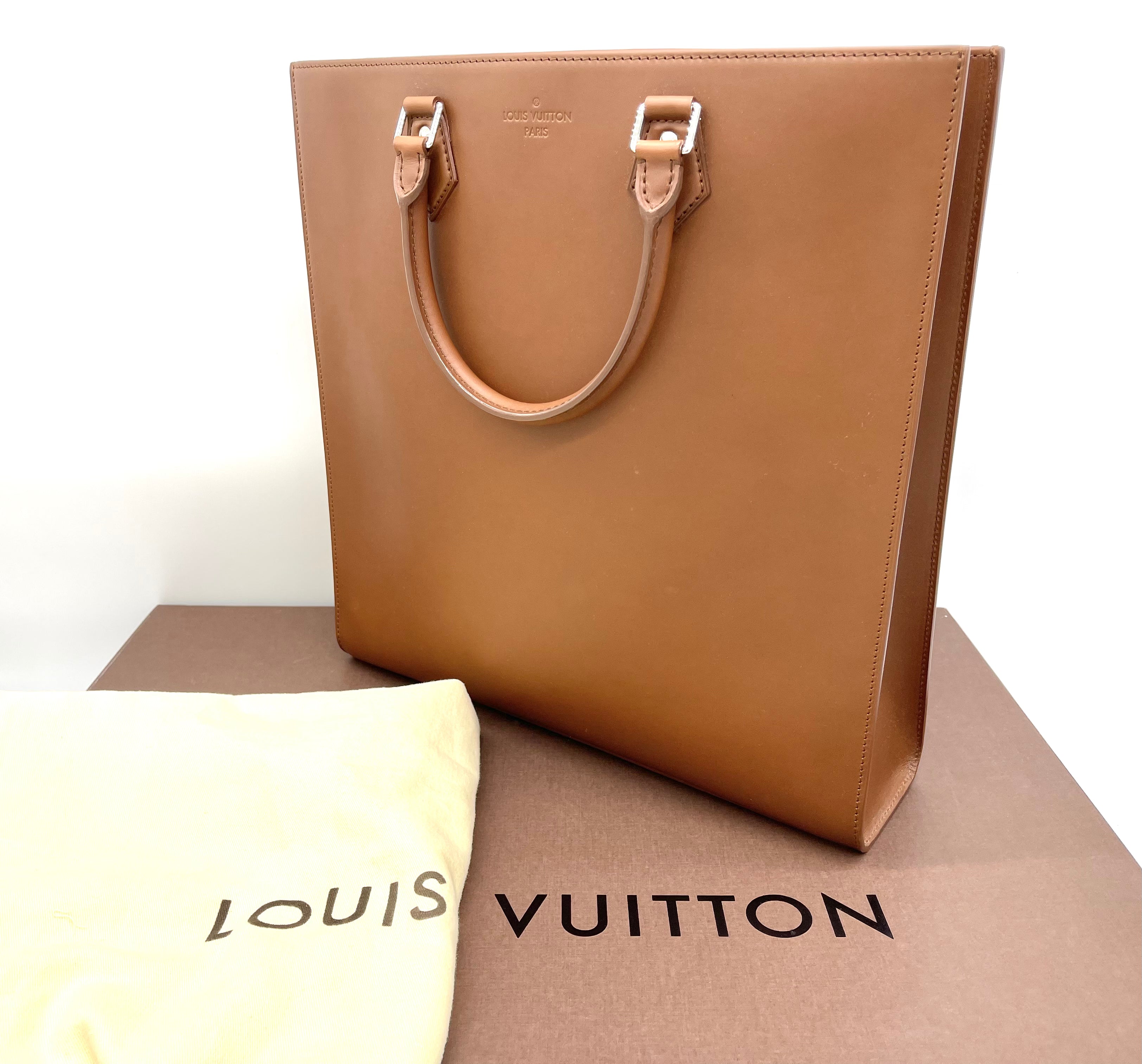 Brand New LOUIS VUITTON Nomade Sac Plat Tobacco