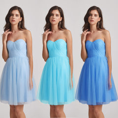short blue tulle bridesmaid dresses in different shades 