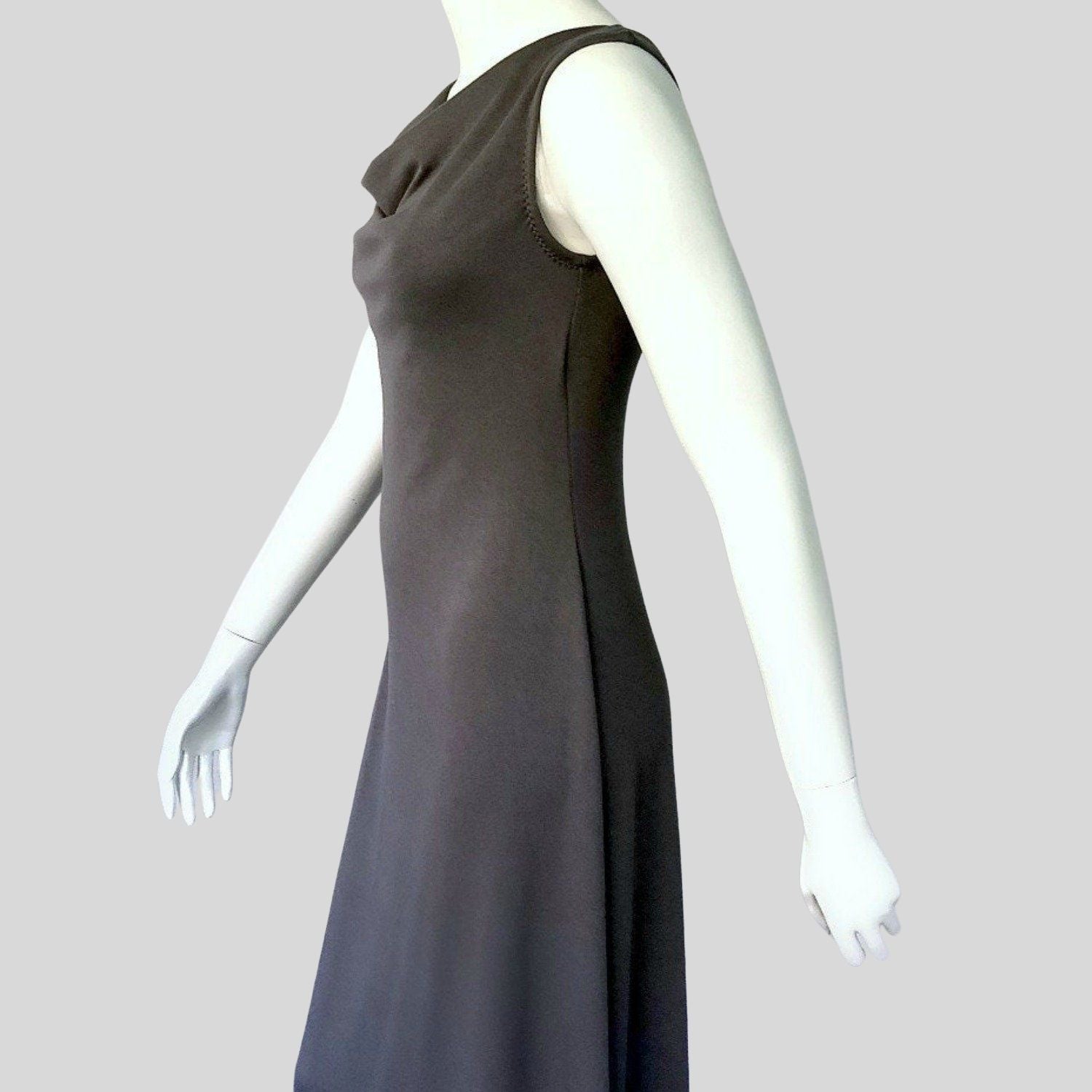 Sleeveless dress with draped neckline