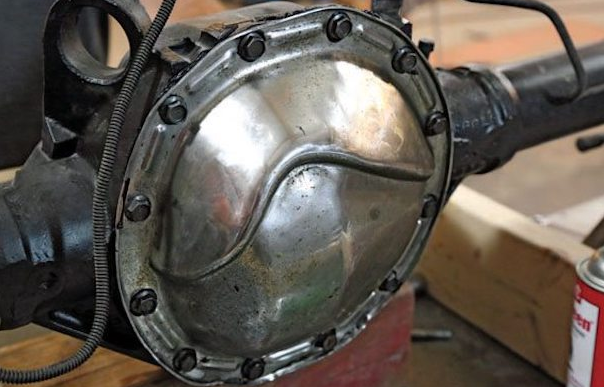 Warped OEM stamped steel differential cover with bent flange causing gear oil leaks