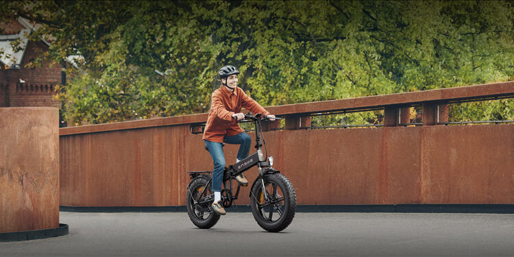 a woman rides a black engwe ep-2 pro e-bike on the road