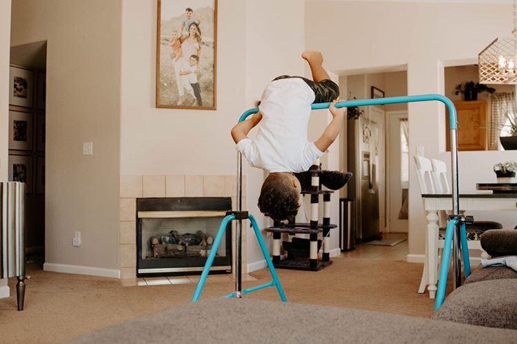 A boy using a Zupapa Folding Gymnastics Bar