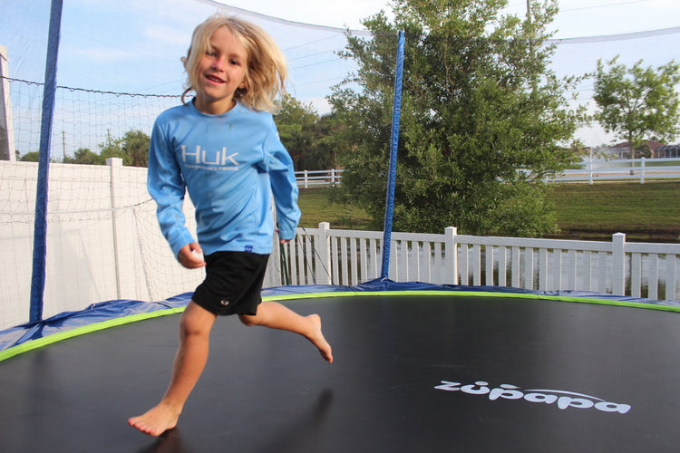 a girl on a Zupapa outdoor trampoline