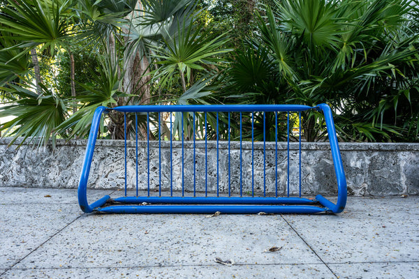 Bicycles Stand on a Transformed Crib Rail