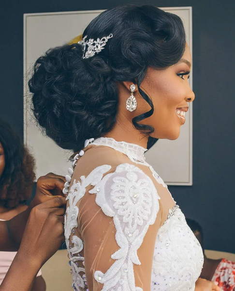 Messy Bun with Side Bang and Loose Curls