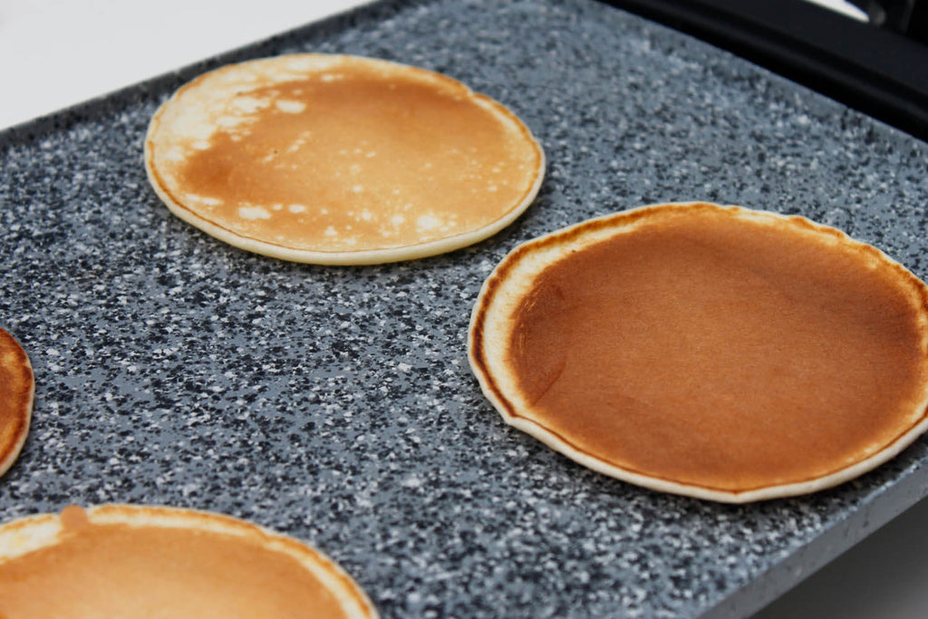 Cooking pancakes on Atgrills gray electric griddle