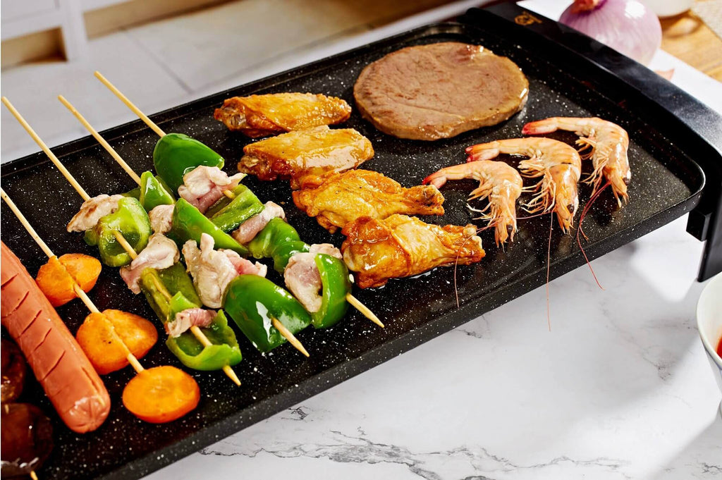 Grill griddle with burger, sausage, shrimp and chicken