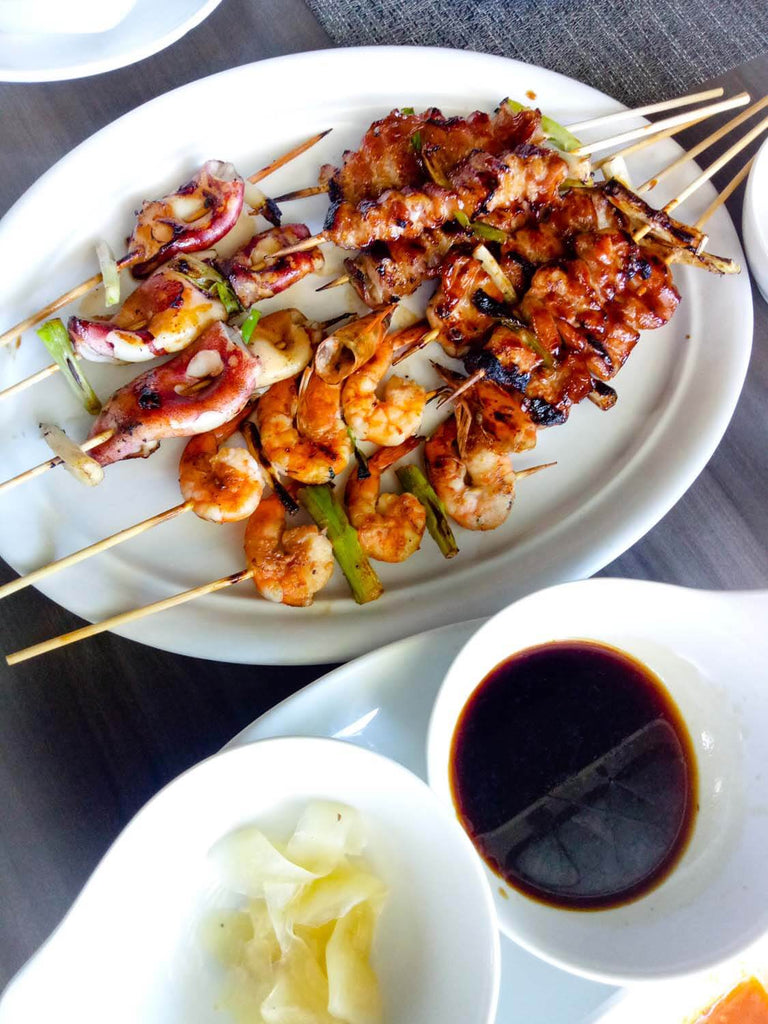 Grilled chicken and sea food on plate