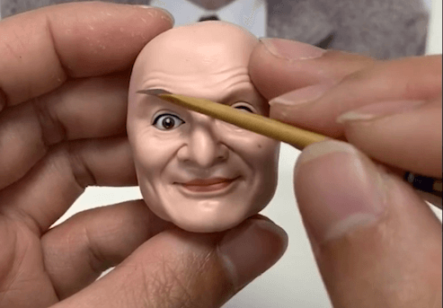 draw his eyebrow of the bobblehead