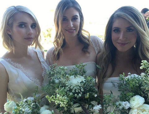 The Scream Queens star wore an ivory lace-trimmed bridesmaid dress