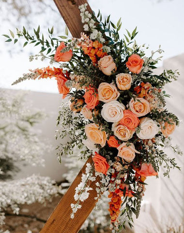 Wedding Arch Flowers with Burnt Orange Cloth