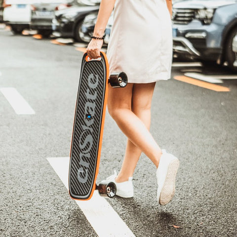 Super portable electric skateboard with a handle and kicktail