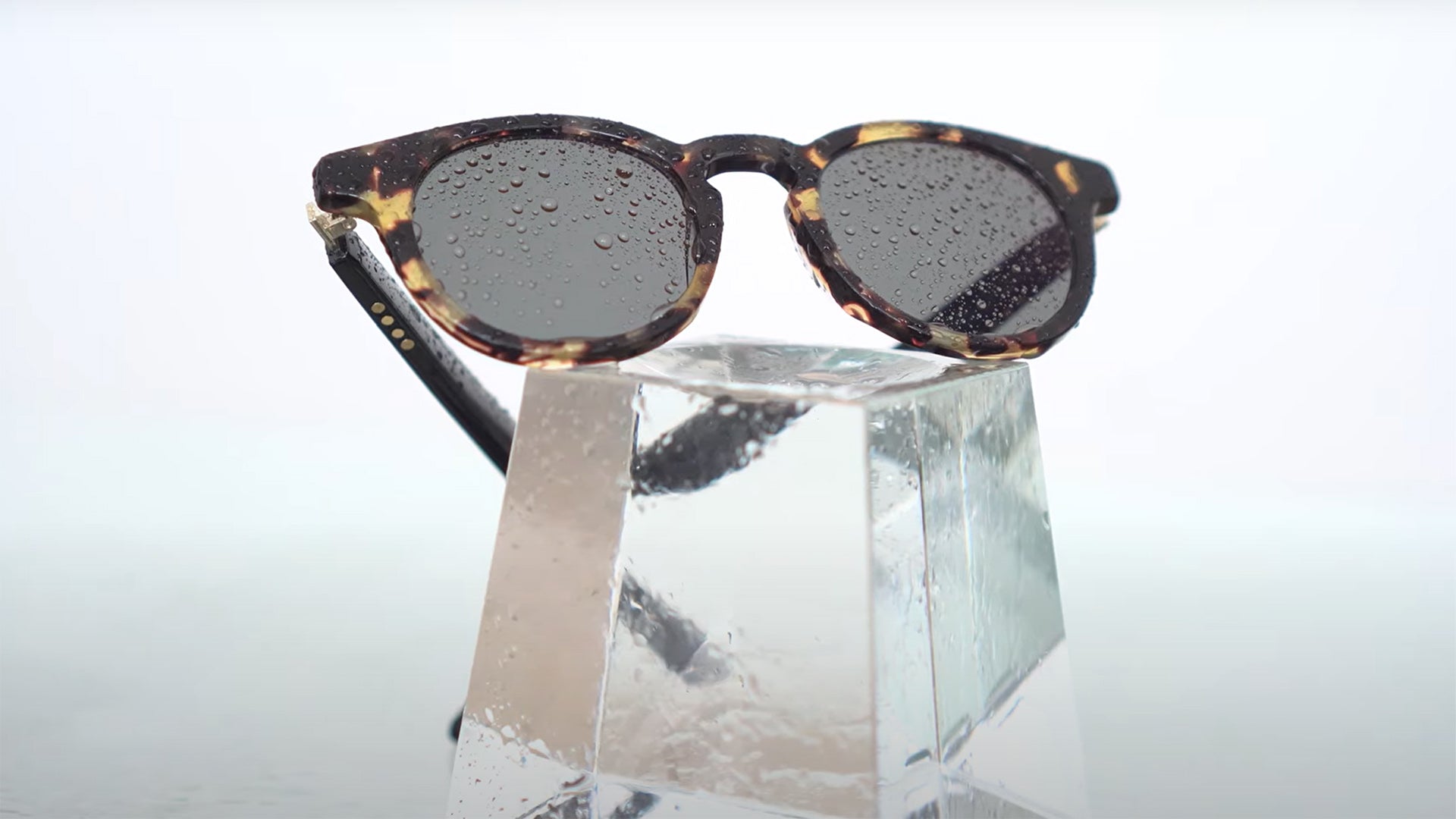 Vue Lite Cygnus glasses with drops of water, possibly rain or sweat, on them to indicate water resistance