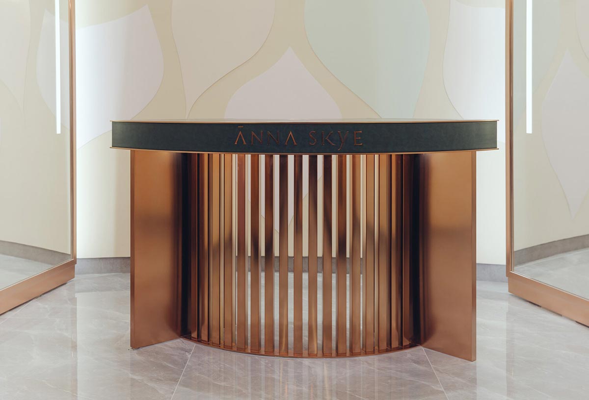Golden brushed stainless steel reception desk