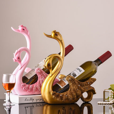 Rosa und goldener Schwanen-Weinflaschenhalter