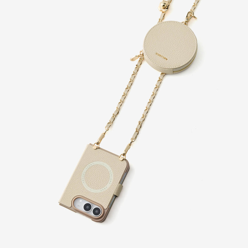Beige iPhone Duo crossbody case with round storage pouch and gold-tone chain strap for travel and everyday use