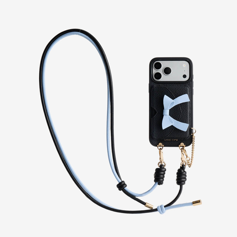 Black iPhone 17 Pro Max crossbody phone case with detachable bow wallet and adjustable shoulder strap for vacation