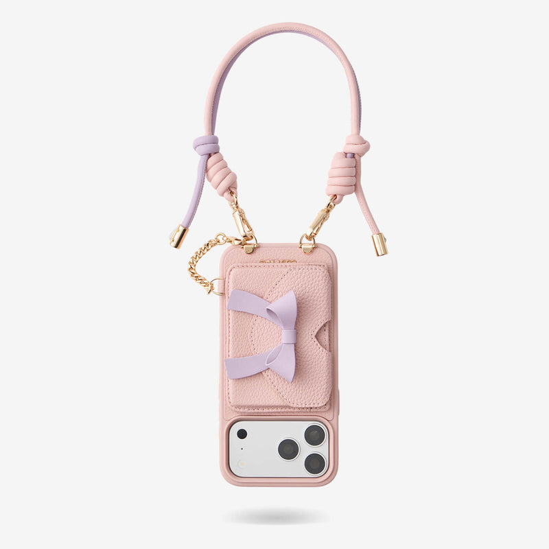 Pink iPhone 18 Pro Max wallet case featuring a removable bow wallet, secure card slots and adjustable wrist strap for travel and everyday essentials