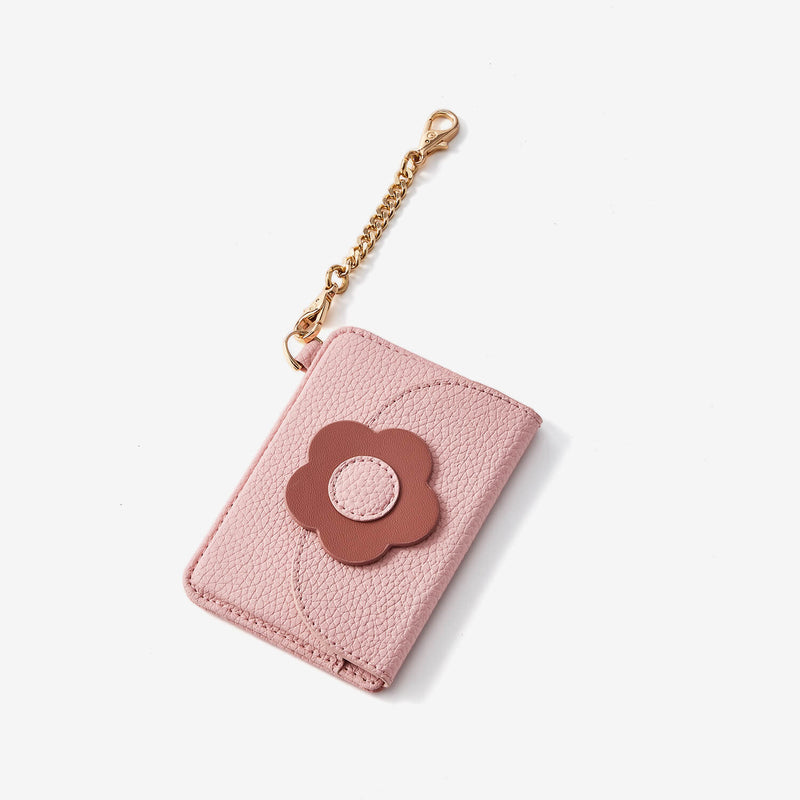 Pink cardholder with a brown flower 