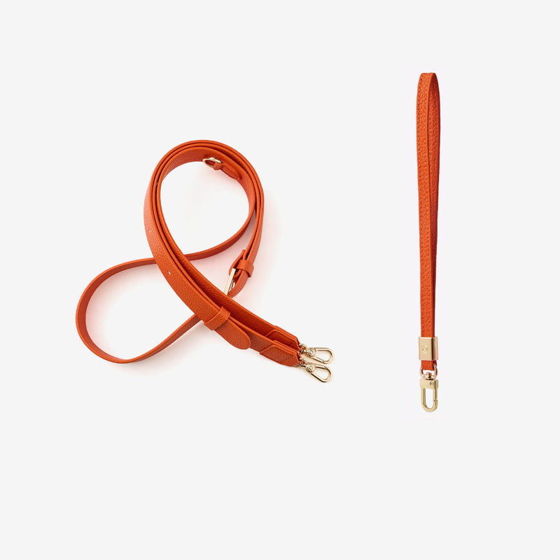 Orange premium leather crossbody strap and wrist strap with gold hardware